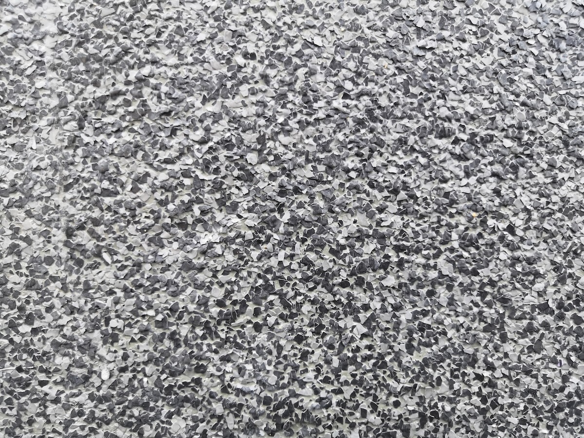 epoxy flake floor Color flake flooring textured background .Close up.Color Flakes make resinous flooring as beautiful as it is practical.Concrete floor,sprinkle with flake stone and smooth.