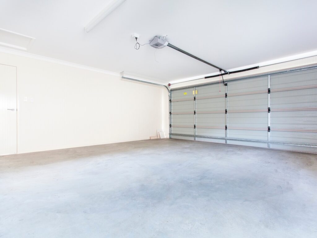 best garage floor coating Empty double garage with automatic door