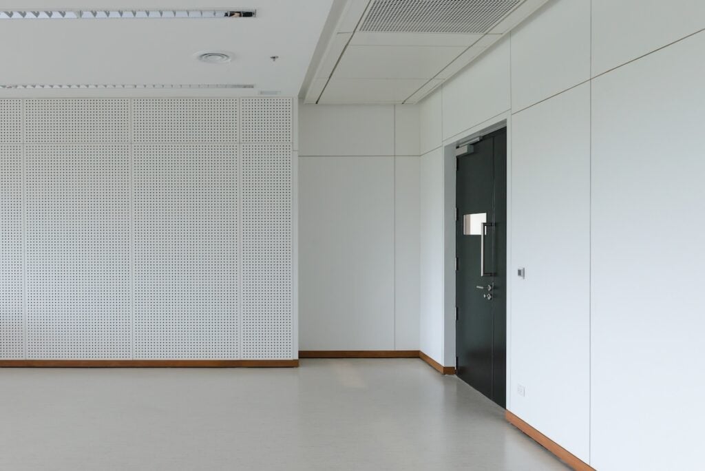 Empty room modern interior - floor with soundproof wall and door how to soundproof a room from outside noise