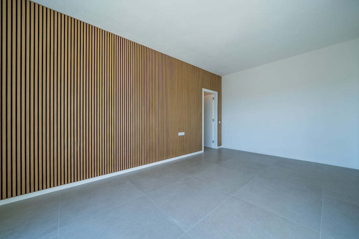 Room with wooden wall texture with wood acoustic panels pattern