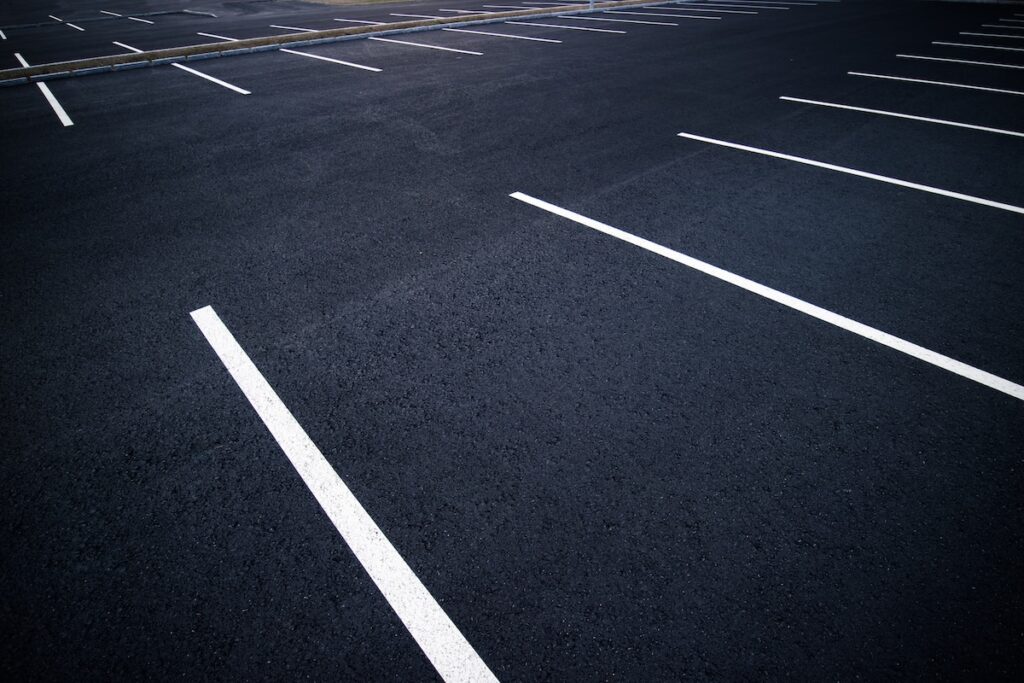 parking lot striping Acres of empty parking spaces