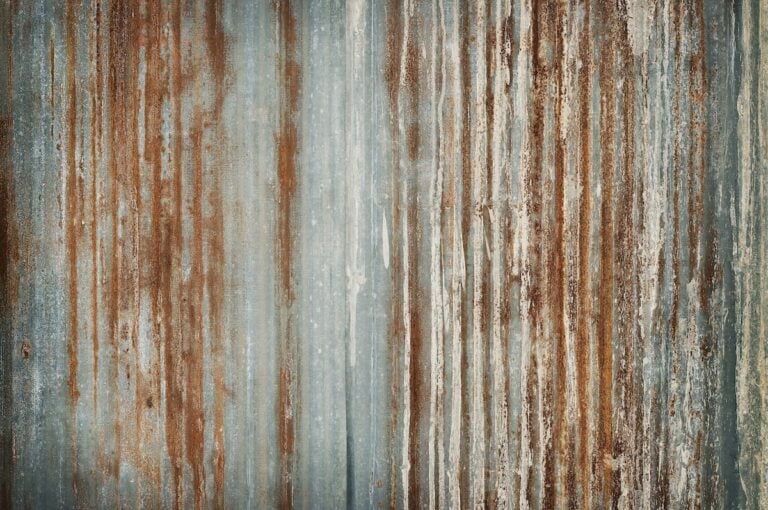 Old zinc wall texture background, rusty on galvanized metal panel sheeting.