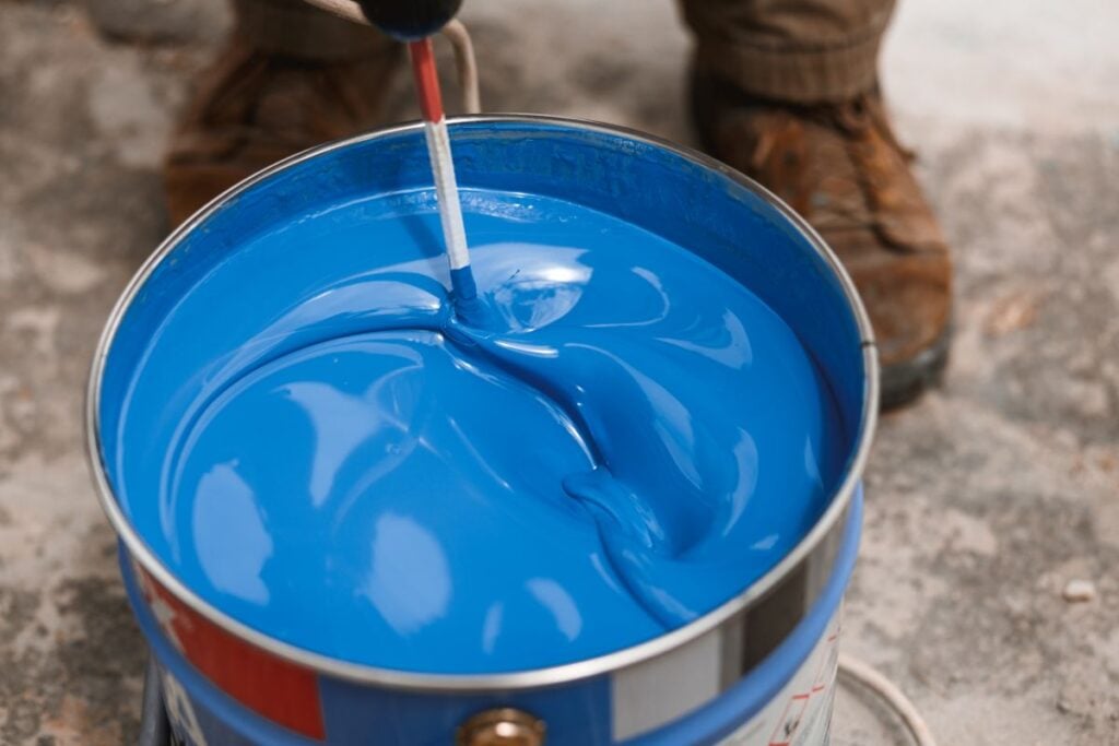 bucket with food grade paint worker mixing