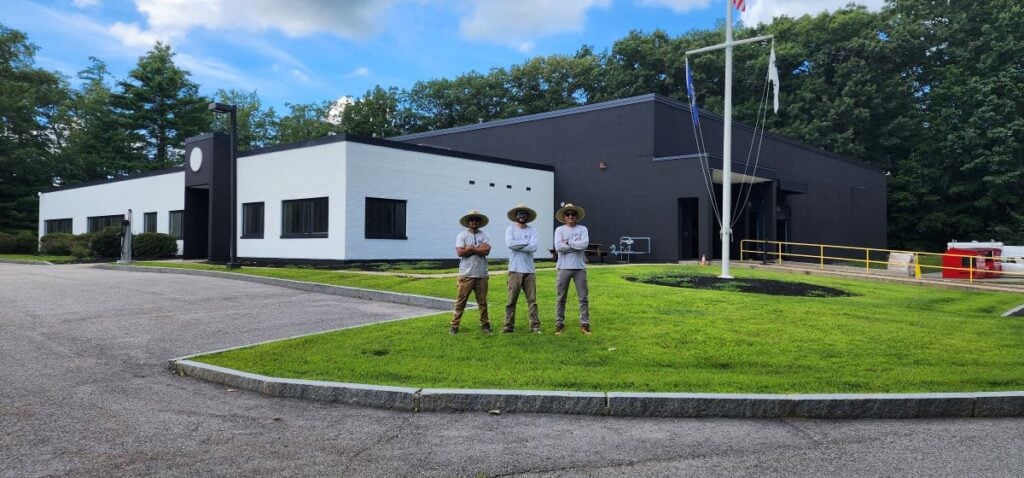 surface preparation for painting McLean Company team standing outside building