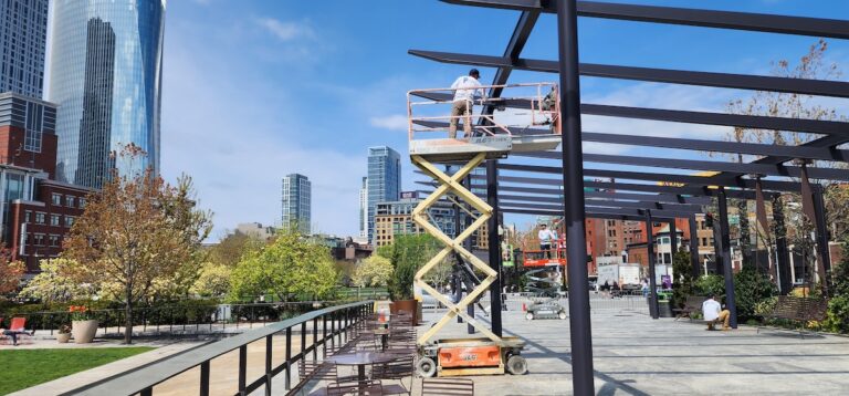 Mclean workers on a lift doing industrial painting