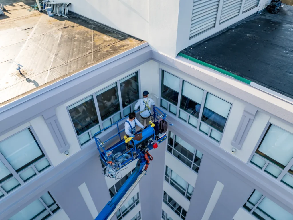 McLean team painting a commercial building