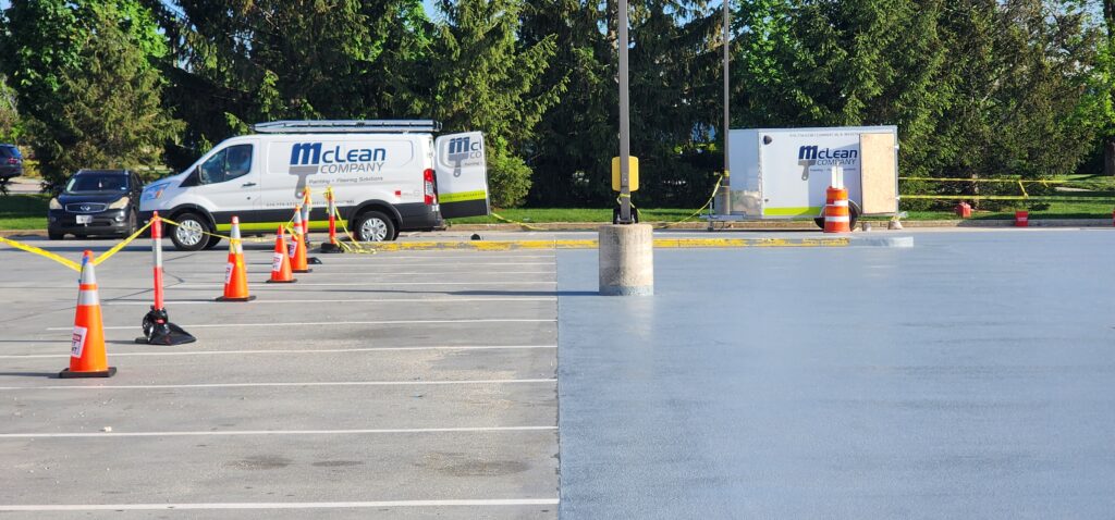 industrial painting services branded van parked outside of building