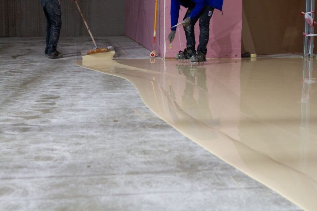 slip resistance treatment workers applying coating
