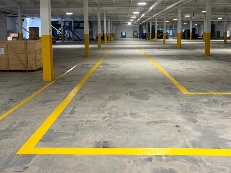 parking lot striping yellow and grey space lights on