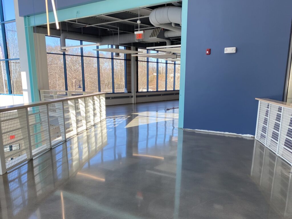 flooring for high traffic areas blue wall shiny floor