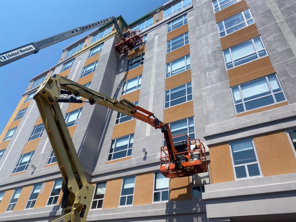 how much do painters charge per square foot grey and yellow building