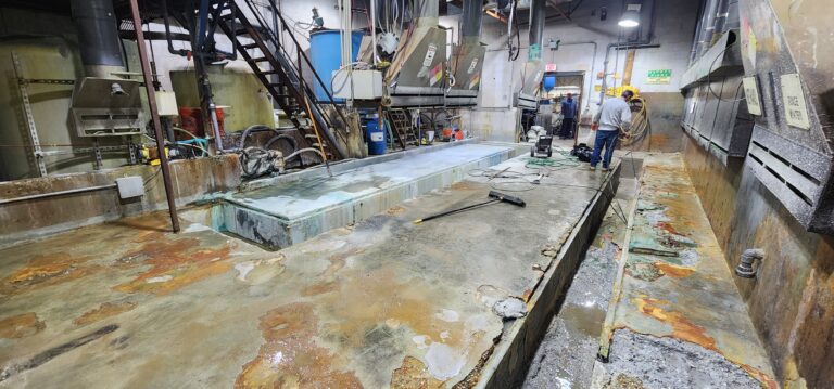 commercial pressure washing worker cleaning floor