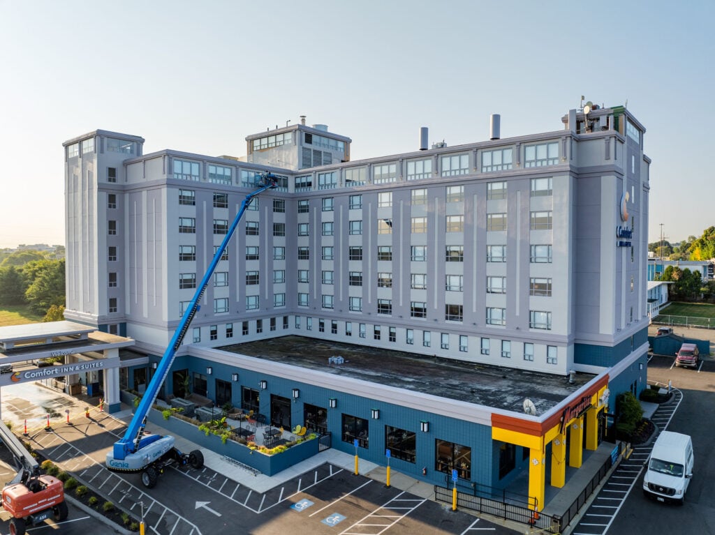 commercial painters boston grey building blue platform