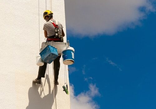 The,View,Of,A,Worker,Climbing,A,Wall,Of,A