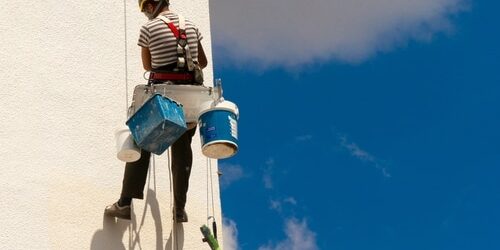 The,View,Of,A,Worker,Climbing,A,Wall,Of,A