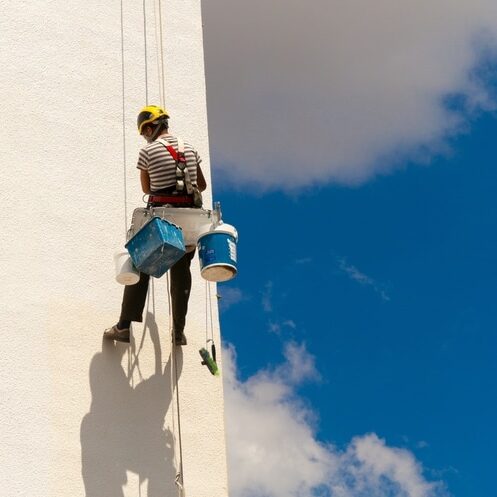 The,View,Of,A,Worker,Climbing,A,Wall,Of,A